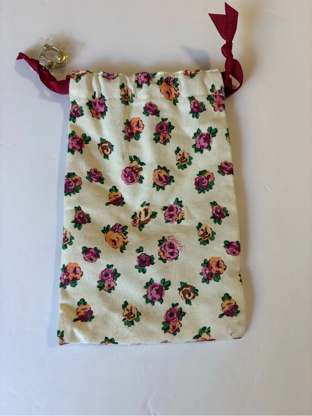 Coach Floral Drawstring Pouch in Cream with Pink & Orange Roses